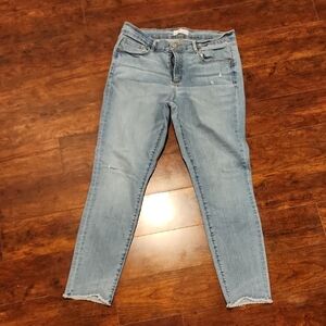 Blue Skinny Loft Jeans with Distressed Hem and Faded Look
